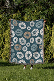 Valu Floral Cotton Throw Blanket in Teal, outdoors