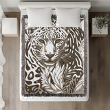 Fiero Leopard Cotton Blend Blanket Throw in Beige and Off-White, on a bed