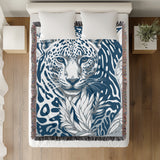 Fiero Leopard Cotton Blend Blanket Throw in Blue and Off-White, on a bed