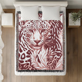 Fiero Leopard Cotton Blend Blanket Throw in Red and Off-White, on a bed