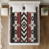 Fika Southwestern Cotton Blend Blanket Throw in Red, Black and Off-White, on a bed