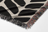 Freda Hand Woven Throw Blanket in Black and Beige, side view