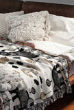 Gardo Elephant Cotton Blend Blanket Throw in Beige, Black and Off-White, on a bed