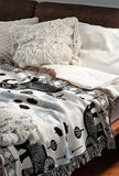 Gardo Elephant Cotton Blend Blanket Throw in Black, Light Blue and Off-White, on a bed