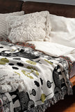 Gardo Elephant Cotton Blend Blanket Throw in Black, Chartreuse and Off-White, on a bed
