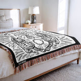 Hero Tibetan Tiger Cotton Blend Blanket Throw in Black and Off-White, on a bed