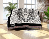 Hero Tibetan Tiger Cotton Blend Blanket Throw in Black and Off-White, draped over a chair