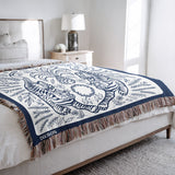 Hero Tibetan Tiger Cotton Blend Blanket Throw in Blue and Off-White, on a bed