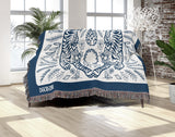 Hero Tibetan Tiger Cotton Blend Blanket Throw in Blue and Off-White, draped over a chair