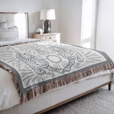 Hero Tibetan Tiger Cotton Blend Blanket Throw in Gray and Off-White, on a bed