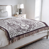 Hero Tibetan Tiger Cotton Blend Blanket Throw in Purple and Off-White, on a bed