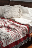 Hero Tibetan Tiger Cotton Blend Blanket Throw in Red and Off-White, on a bed