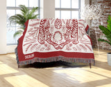 Hero Tibetan Tiger Cotton Blend Blanket Throw in Red and Off-White, draped over a chair