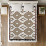 Hinto Southwestern Cotton Blend Blanket Throw in Beige and Off-White, on a bed