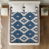 Hinto Southwestern Cotton Blend Blanket Throw in Blue and Off-White, on a bed
