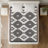 Hinto Southwestern Cotton Blend Blanket Throw in Gray and Off-White, on a bed