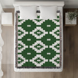 Hinto Southwestern Cotton Blend Blanket Throw in Green and Off-White, on a bed