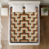 Jansen Cotton Blend Blanket Throw in Burnt Orange, draped over a chair