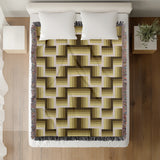 Jansen Cotton Blend Blanket Throw in Yellow and Beige, draped over a chair