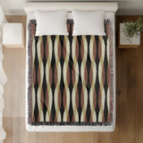 Jordyn Cotton Blend Blanket Throw in Black, on a bed