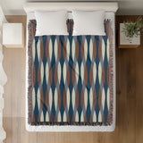 Jordyn Cotton Blend Blanket Throw in Blue, on a bed