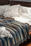 Jordyn Cotton Blend Blanket Throw in Blue, draped over a chair