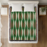 Jordyn Cotton Blend Blanket Throw in Green, on a bed