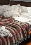 Jordyn Cotton Blend Blanket Throw in Red, draped over a chair