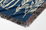 Josu Giraffe Cotton Blend Blanket Throw in Blue and Off-White, draped over a chair