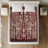 Josu Giraffe Cotton Blend Blanket Throw in Red and Off-White, on a bed