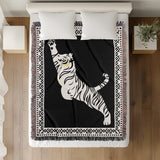 Kat Tiger Cotton Blend Blanket Throw in Black and Off-White, on a bed