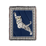 Kat Tiger Cotton Blend Blanket Throw in Blue and Off-White, on a bed