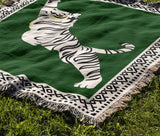 Kat Tiger Cotton Blend Blanket Throw in Green and Off-White, draped over a chair