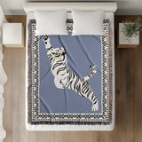 Kat Tiger Cotton Blend Blanket Throw in Light Blue and Off-White, on a bed