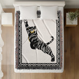Kat Tiger Cotton Blend Blanket Throw in Off-White, on a bed