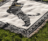 Kat Tiger Cotton Blend Blanket Throw in Off-White, draped over a chair