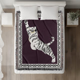 Kat Tiger Cotton Blend Blanket Throw in Purple and Off-White, on a bed