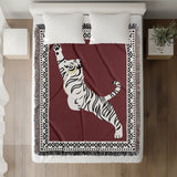 Kat Tiger Cotton Blend Blanket Throw in Red and Off-White, on a bed
