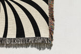 Konga Hand Woven Throw Blanket in Black and Beige, side view