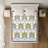 Kossy Giraffe Cotton Blend Blanket Throw in Blue, Green and Off-White, on a bed