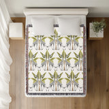 Kossy Giraffe Cotton Blend Blanket Throw in Gray, Green and Off-White, on a bed