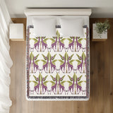 Kossy Giraffe Cotton Blend Blanket Throw in Purple, Green and Off-White, on a bed