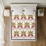 Kossy Giraffe Cotton Blend Blanket Throw in Red, Green and Off-White, on a bed