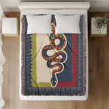 Kotu Snake Cotton Blend Blanket Throw in Red, Green and Blue Gray, on a bed