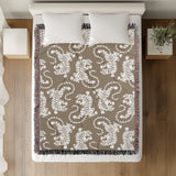 Leonard Tiger Cotton Blend Blanket Throw in Beige and Off-White, on a bed