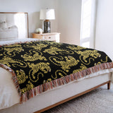Leonard Tiger Cotton Blend Blanket Throw in Black and Off-White, on a bed
