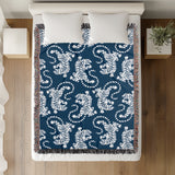 Leonard Tiger Cotton Blend Blanket Throw in Blue and Off-White, on a bed