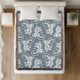 Leonard Tiger Cotton Blend Blanket Throw in Blue Gray and Off-White, on a bed