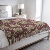 Leonard Tiger Cotton Blend Blanket Throw in Red and Off-White, on a bed