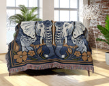 Lim Elephant Cotton Blend Blanket Throw in Black, Blue and Red, on a bed